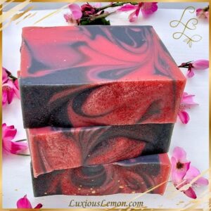 Handcrafted Sweet Cherry Dogwood Bar Soap with vibrant pink and white swirls, infused with a delightful blend of cherry, pineapple, and honey crisp, accented by the fresh aroma of dogwood flowers – Luxious Lemon artisan soap.