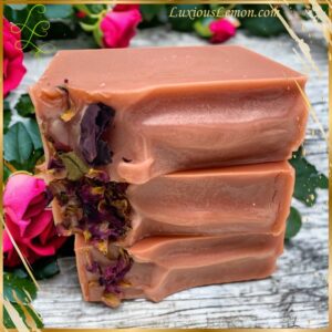 Bulgarian Rose Goat Milk Soap bar displayed on a neutral surface, highlighting its smooth, creamy texture and subtle swirl pattern, reflecting its handcrafted quality.