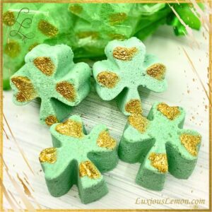 Bag of Lucky Clover Shower Steamers - St Patrick's Day treats in festive green clover shapes with shimmering gold accents. Infused with menthol, and essential oils of eucalyptus, peppermint, and spearmint, these aromatherapy steamers offer a refreshing and invigorating spa-like experience. Perfect for self-care or as a lucky gift.