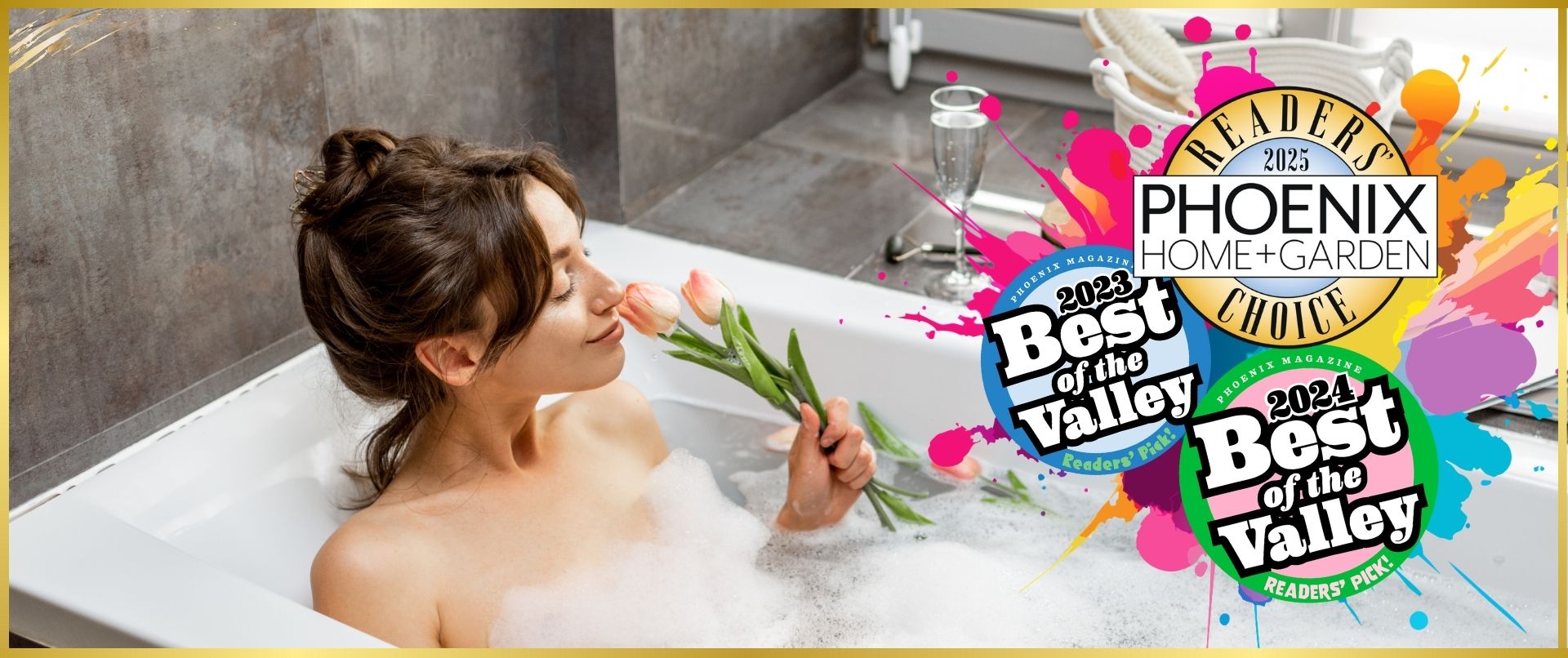 A woman with dark hair in a loose bun enjoys a relaxing bubble bath, holding a bouquet of pink tulips close to her face with a peaceful smile. The modern bathroom setting includes a glass of champagne, a woven basket with spa essentials, and soft natural lighting. Vibrant award badges overlay the image, highlighting (Best of the Valley 2023 & 2024) and (Phoenix Home + Garden Reader's Choice 2025) emphasizing a luxurious and award-winning self-care experience.