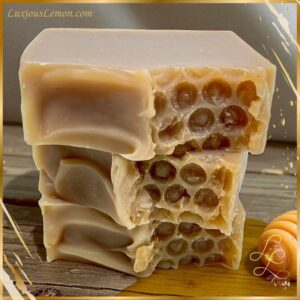 Luxious Lemon Oatmeal, Milk & Manuka Honey Bar Soap — creamy tan handcrafted soap bars stacked with a honeycomb-textured design, made with natural oatmeal, nourishing milk, and manuka honey.