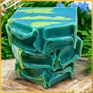 Under the Stars bar soap from Luxious Lemon®, featuring deep teal and green swirls with a creamy handcrafted texture. A moisturizing, artisan soap made with nourishing oils for a rich, gentle lather.