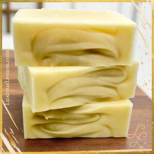 Three stacked bars of Luxious Lemon Unscented Goat’s Milk Soap with a creamy ivory color and natural swirl texture. Gentle, fragrance-free bar made with goat’s milk for sensitive skin, moisturizing and toxin-free.